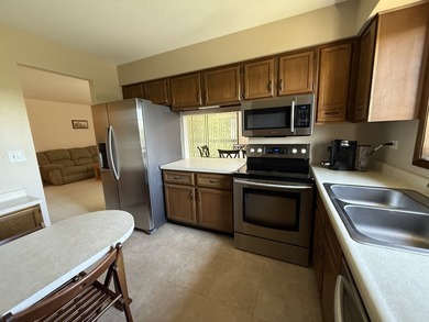 Welcome to this beautifully maintained second-floor condo in the - photo 7