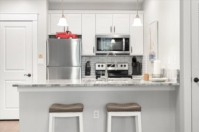 Escape to the perfect beach haven with this beautifully upgraded - photo 3
