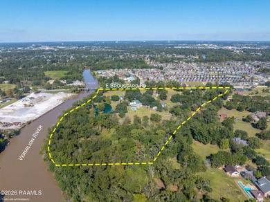 Set on 27 wooded acres in Lafayette, LA, this rare private - photo 3
