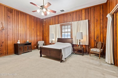 Set on 27 wooded acres in Lafayette, LA, this rare private - photo 8