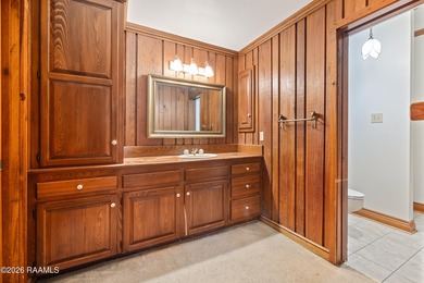 Set on 27 wooded acres in Lafayette, LA, this rare private - photo 9