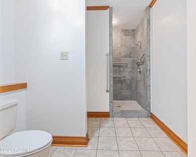 Set on 27 wooded acres in Lafayette, LA, this rare private - photo 10
