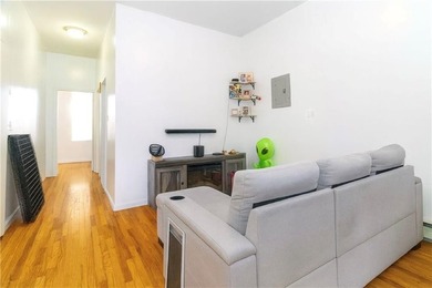 Introducing a distinguished three-family residence offering both - photo 3