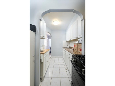 All brick 2 family home with private drive. 2 bedrooms in each - photo 4