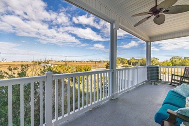 Welcome to this beautifully maintained Marsh Winds end-unit