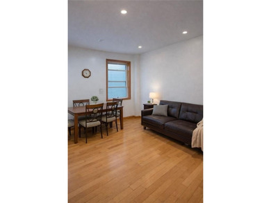 A beautifully renovated two-family residence in the heart of - photo 5