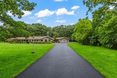WOW!! Nestled on an extraordinary 1.75-acre wooded estate in - photo 3