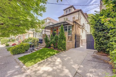 Welcome to 90-10 69th Avenue - a private, detached 2-family home - photo 1