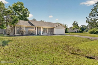 Welcome home to this charming 3-bedroom, 2-bath residence in the - photo 3