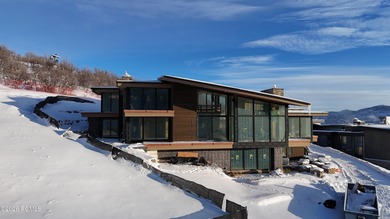 This exquisite ski-in/ski-out masterpiece is nestled in the - photo 9