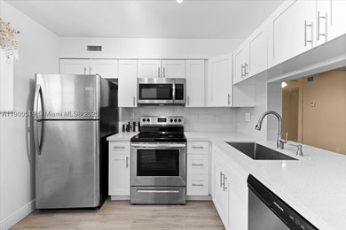 Welcome to this beautifully upgraded corner unit condo in the - photo 2