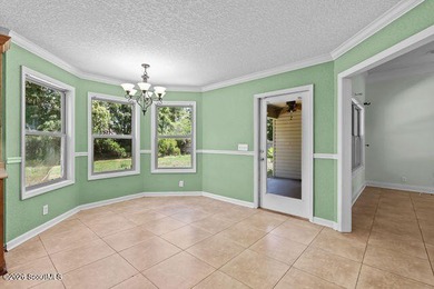 A welcoming three-bedroom, two-bath vinyl-sided home combines - photo 13
