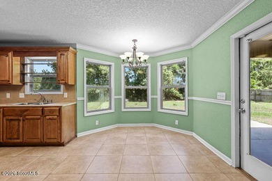 A welcoming three-bedroom, two-bath vinyl-sided home combines - photo 14