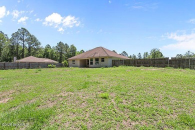 A welcoming three-bedroom, two-bath vinyl-sided home combines - photo 32
