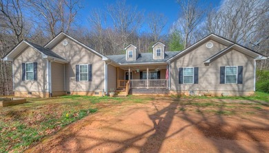 Located on 5.73 acres of UNRESTRICTED wooded land, this - photo 3