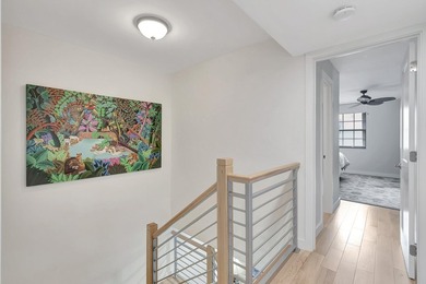 Envision residing just steps away from the serene beachfront of - photo 6