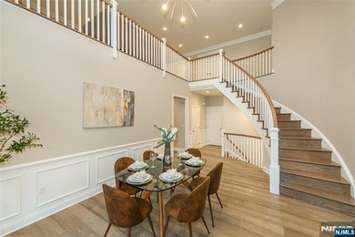 Welcome to this stunning 3 bedroom, 4 full baths and 1 half bath