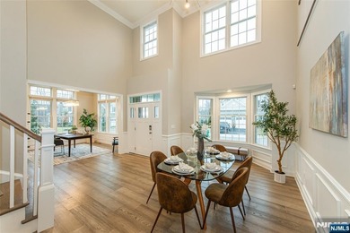 Welcome to this stunning 3 bedroom, 4 full baths and 1 half bath