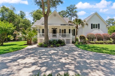 Nestled beneath a mature oak tree and surrounded by established - photo 1