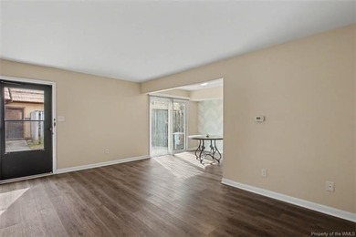 Freshly painted, newer LVP floors downstairs, newer carpet - photo 3