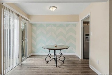 Freshly painted, newer LVP floors downstairs, newer carpet - photo 6