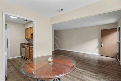 Freshly painted, newer LVP floors downstairs, newer carpet - photo 8