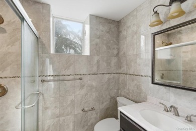 Located on a high bluff overlooking the Long Island Sound, this - photo 38