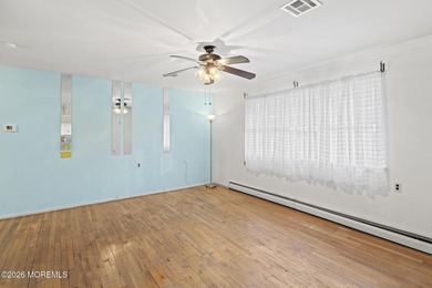 Approach this home via a low-maintenance composite deck with a