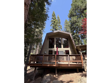 Escape to your own cozy cabin tucked away in the serene woods of - photo 3