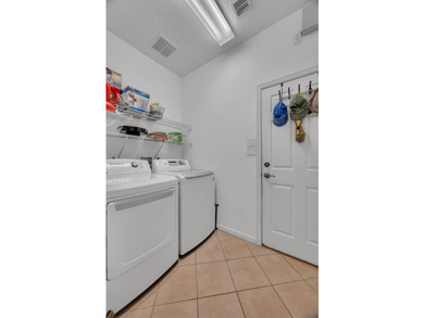 Nestled in the desirable gated community of Magnolia Lakes in - photo 17