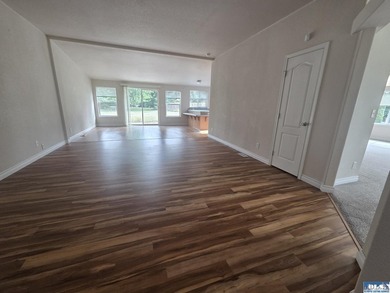 Space and natural light abound in this beautifully maintained - photo 3