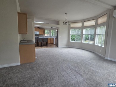 Space and natural light abound in this beautifully maintained - photo 5