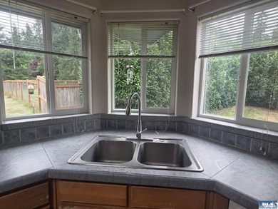 Space and natural light abound in this beautifully maintained - photo 7