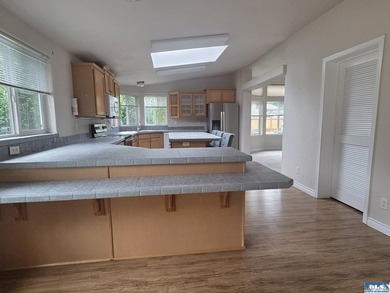 Space and natural light abound in this beautifully maintained - photo 9