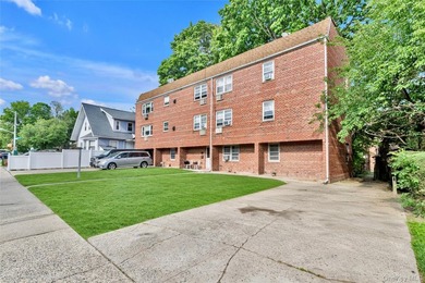 36-11 Utopia Parkway is a detached brick legal 2-family home - photo 2