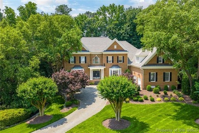 Enjoy gracious living in this stately golf-front brick home in - photo 1