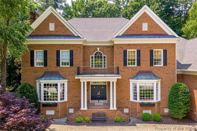 Enjoy gracious living in this stately golf-front brick home in - photo 2