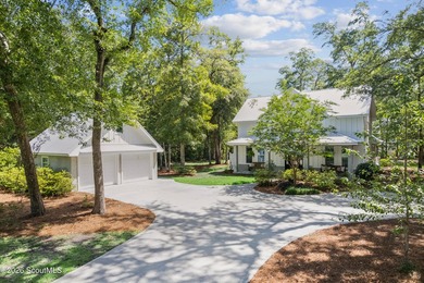 Welcome to this stunning custom-built marsh front home in the - photo 1