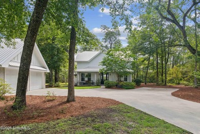 Welcome to this stunning custom-built marsh front home in the - photo 2