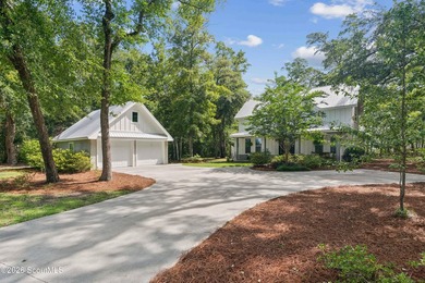Welcome to this stunning custom-built marsh front home in the - photo 3