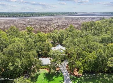 Welcome to this stunning custom-built marsh front home in the - photo 5