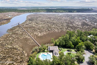 Welcome to this stunning custom-built marsh front home in the - photo 10