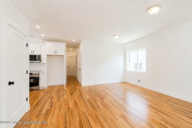 An exceptional new construction 6/6 two-family home offering 2 - photo 9