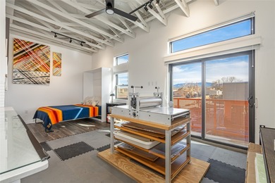 Corner unit with a wraparound balcony and mountain views in