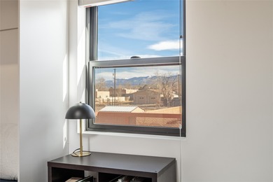 Corner unit with a wraparound balcony and mountain views in