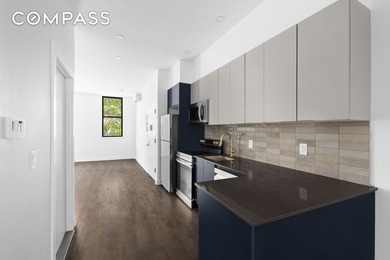 Welcome to 92 Wilson Avenue, a tastefully renovated three-family - photo 3