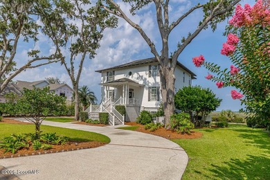 Set along the marsh in the prestigious gated community of - photo 2