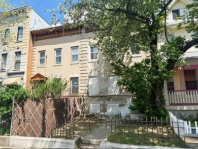 This five-bedroom, two-bathroom multi-unit property is located - photo 1