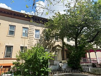 This five-bedroom, two-bathroom multi-unit property is located - photo 2