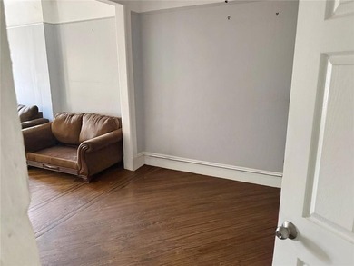 This five-bedroom, two-bathroom multi-unit property is located - photo 3
